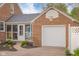 A spacious two car garage attached to the home with a side screened in porch at 3221 Washington St, Columbus, IN 47203