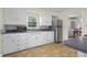 Spacious kitchen with stainless steel appliances, white cabinets, and lavender countertops at 3221 Washington St, Columbus, IN 47203