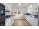 A kitchen featuring white cabinets, tile floors, and stainless steel appliances at 3221 Washington St, Columbus, IN 47203