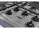 Close up of a KitchenAid gas stovetop with black knobs on a lavender countertop at 3221 Washington St, Columbus, IN 47203