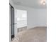 Bedroom featuring neutral carpet, white walls, and doorway to the rest of the house at 326 N Warman Ave, Indianapolis, IN 46222