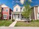 Inviting two-story home with a quaint front porch and neatly kept front yard at 326 N Warman Ave, Indianapolis, IN 46222