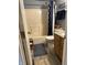 Bathroom featuring a shower-tub combo, a toilet and a vanity at 326 Virginia St, Fortville, IN 46040