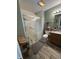 Updated bathroom featuring a glass door shower and ceramic tile flooring at 326 Virginia St, Fortville, IN 46040