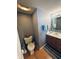 Well-lit bathroom with a vanity, mirror with accent tile, and a standard toilet at 326 Virginia St, Fortville, IN 46040