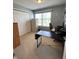 Neutral bedroom features carpeted floors, a window, a closet and a desk at 326 Virginia St, Fortville, IN 46040