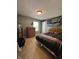 Comfortable bedroom features neutral carpeted floors, a bed and a window at 326 Virginia St, Fortville, IN 46040