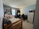 Cozy bedroom features carpeted floors, a bed, a desk and a TV at 326 Virginia St, Fortville, IN 46040