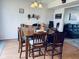 Inviting dining room featuring a large wooden table with seating for eight at 326 Virginia St, Fortville, IN 46040