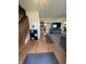 Inviting entryway with hardwood floors leading to a staircase and the kitchen at 326 Virginia St, Fortville, IN 46040