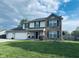 Beautiful two-story home with brick and siding exterior and a well-kept front lawn at 326 Virginia St, Fortville, IN 46040