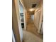Upstairs hallway with carpeted flooring and doors leading to bedrooms and closet space at 326 Virginia St, Fortville, IN 46040