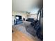 Inviting living room featuring modern furniture, TV, and wood laminate flooring at 326 Virginia St, Fortville, IN 46040