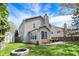 Lovely backyard with a patio, a fire pit, and manicured landscaping at 3466 Firethorn Dr, Whitestown, IN 46075