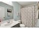Bathroom featuring a vanity with sink, floral shower curtain, and soft color palette at 3466 Firethorn Dr, Whitestown, IN 46075