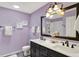 Bathroom with double vanity, white countertops, and modern fixtures at 3466 Firethorn Dr, Whitestown, IN 46075