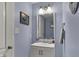 Powder room featuring a single sink vanity with an framed mirror and towel rack at 3466 Firethorn Dr, Whitestown, IN 46075