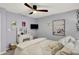 Comfortable bedroom with ceiling fan, desk, and white bedding at 3466 Firethorn Dr, Whitestown, IN 46075