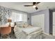 Bedroom with a ceiling fan, large window, and closet providing ample storage space at 3466 Firethorn Dr, Whitestown, IN 46075