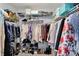 Walk-in closet featuring wire shelving and clothing racks filled with clothes, shoes, and storage boxes at 3466 Firethorn Dr, Whitestown, IN 46075