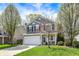 Charming two-story home featuring a well-maintained lawn, attached two-car garage, and inviting front porch at 3466 Firethorn Dr, Whitestown, IN 46075