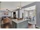Open-concept living and dining area with stylish decor and hardwood flooring at 3466 Firethorn Dr, Whitestown, IN 46075
