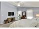 Comfortable main bedroom featuring a TV, dresser, and mirror at 3466 Firethorn Dr, Whitestown, IN 46075