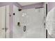 Modern bathroom shower with glass door and dark hardware, including a rainfall shower head at 3466 Firethorn Dr, Whitestown, IN 46075