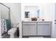 Bathroom with a double vanity with quartz counters, toilet, and walk-in shower at 360 Lincoln W Cir, Fortville, IN 46040