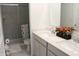 Bright bathroom features a double vanity with sleek countertops and a spacious tiled shower for convenience at 360 Lincoln W Cir, Fortville, IN 46040