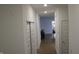 Hallway with wood floors that offers a view to the dining room and kitchen for a smooth transition at 360 Lincoln W Cir, Fortville, IN 46040