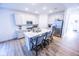 Modern kitchen featuring stainless steel appliances, a large island, and ample cabinet space at 360 Lincoln W Cir, Fortville, IN 46040