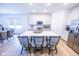 Bright, modern kitchen featuring a large island with seating, stainless steel appliances, and ample counter space at 360 Lincoln W Cir, Fortville, IN 46040