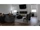 Comfortable living room has a stylish electric fireplace, plush seating, and modern decor at 360 Lincoln W Cir, Fortville, IN 46040