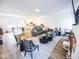 Spacious living room featuring modern furnishings, a large sectional, and an open-concept design at 360 Lincoln W Cir, Fortville, IN 46040
