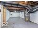 Unfinished basement with exposed duct work and mechanicals provides extra storage at 3758 Broadway St, Indianapolis, IN 46205