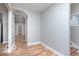 Inviting entryway with wood-look floors, light grey walls, and ample natural light at 3758 Broadway St, Indianapolis, IN 46205