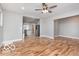 Open-concept living area with laminate floors and a glimpse of the modern kitchen at 3758 Broadway St, Indianapolis, IN 46205