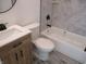 Modern bathroom featuring a wood vanity and bathtub with attractive tile at 4234 Kingsley Dr, Indianapolis, IN 46205