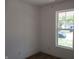 Bedroom features light flooring and a large window with a view of the neighborhood at 4234 Kingsley Dr, Indianapolis, IN 46205