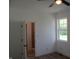 Bedroom featuring wood-look floors, ceiling fan, and ensuite bathroom at 4234 Kingsley Dr, Indianapolis, IN 46205