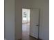 View into light-filled room featuring wood-look flooring and white trim at 4234 Kingsley Dr, Indianapolis, IN 46205
