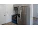 Modern kitchen with stainless steel appliances and grey cabinets and a black oven at 4234 Kingsley Dr, Indianapolis, IN 46205
