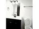Modern bathroom featuring a new vanity and sink, toilet, and a well-lit mirror, offering a fresh and clean look at 436 Tavistock Dr, Mooresville, IN 46158