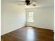 Bedroom featuring hardwood flooring, a ceiling fan, and natural light from a window at 436 Tavistock Dr, Mooresville, IN 46158
