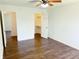 Spacious bedroom featuring hardwood flooring, ample closet space, and neutral walls at 436 Tavistock Dr, Mooresville, IN 46158