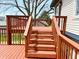 Deck with staircase overlooks lush greenery and mature trees at 436 Tavistock Dr, Mooresville, IN 46158