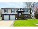Charming two-story home with a well-maintained lawn, two-car garage and nice landscaping at 436 Tavistock Dr, Mooresville, IN 46158