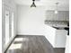 Modern eat-in kitchen with new countertops, stainless steel sink and new wood floor at 436 Tavistock Dr, Mooresville, IN 46158