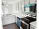 Modern kitchen featuring updated appliances, mosaic backsplash, and bright lighting at 436 Tavistock Dr, Mooresville, IN 46158
